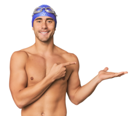 Young Hispanic man with swim gear excited holding a copy space on palm.