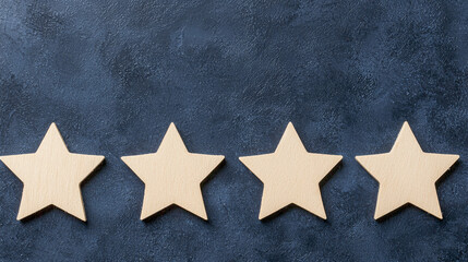Four wooden stars on dark textured background, symbolizing rating or review