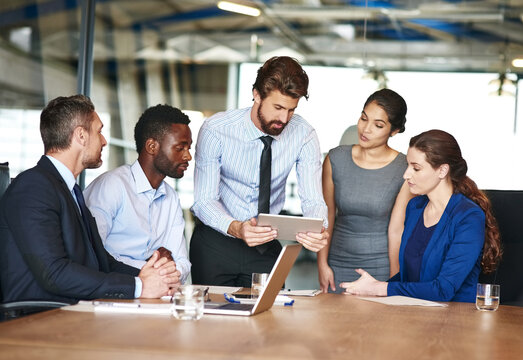 Tablet, finance team and business people planning in meeting with manager for solution. Group, technology and brainstorming ideas for investment or profit growth with cryptocurrency advisor in office