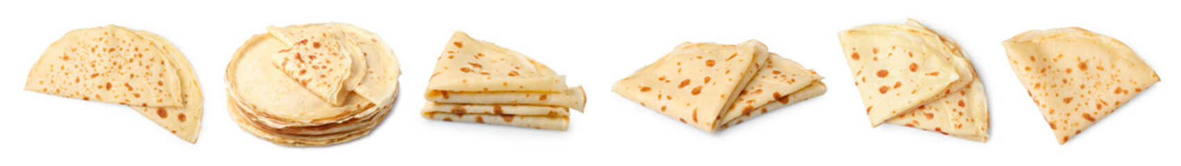 Set of delicious thin crepes on white background