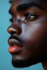 High-resolution portrait of a man's lips with a subtle smile, warm lighting, and sharp focus