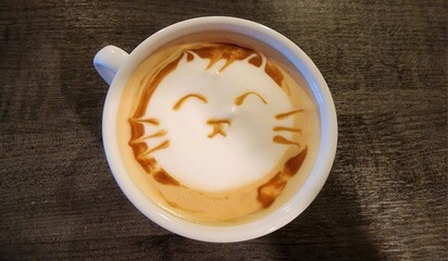 Cute Cat Latte Art in Coffee Mug on Wooden Table Surface