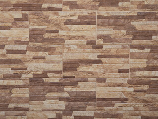 Multicolor Vesuvius porcelain tiles wall texture with sandstone effect. Background of textured rustic classic elegant slabs for walls, facades, privacy dividing walL, plot division in earthy tones. 