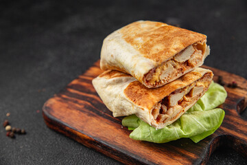 donner kebab chicken and vegetables shawarma sandwich tortilla meat filling fast food flatbread fresh tasty food dish gourmet food background on the table rustic food top view copy space