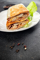donner kebab chicken and vegetables shawarma sandwich tortilla meat filling fast food flatbread fresh tasty food dish gourmet food background on the table rustic food top view copy space