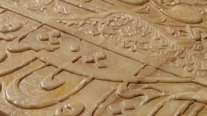 Shiraz, Iran - December 8, 2024: Quranic verses engraved on Hafiz Shirazi tomb