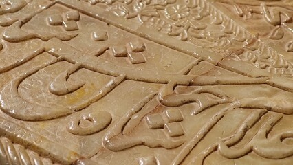 Shiraz, Iran - December 8, 2024: Quranic verses engraved on Hafiz Shirazi tomb