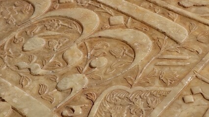 Shiraz, Iran - December 8, 2024: Quranic verses engraved on Hafiz Shirazi tomb