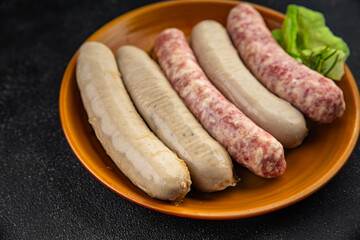 raw sausages pork, beef, chicken, lamb fresh tasty food dish gourmet food background on the table rustic food top view copy space