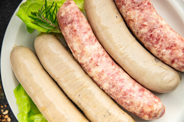 raw sausages pork, beef, chicken, lamb fresh tasty food dish gourmet food background on the table rustic food top view copy space