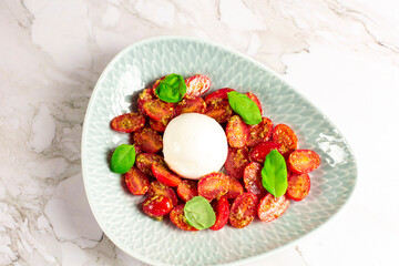 Farmer Italian soft cheese mozzarella served with fresh basil and red cherry tomatoes