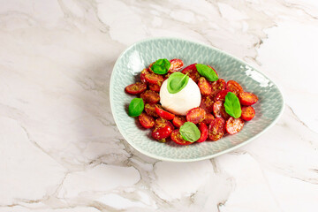 Farmer Italian soft cheese mozzarella served with fresh basil and red cherry tomatoes
