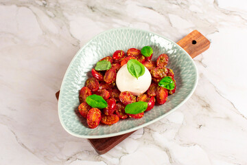 Farmer Italian soft cheese mozzarella served with fresh basil and red cherry tomatoes