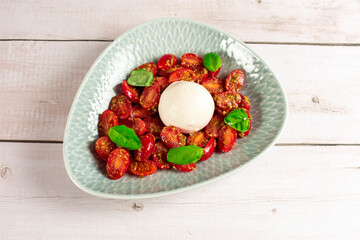 Farmer Italian soft cheese mozzarella served with fresh basil and red cherry tomatoes