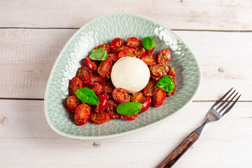 Farmer Italian soft cheese mozzarella served with fresh basil and red cherry tomatoes