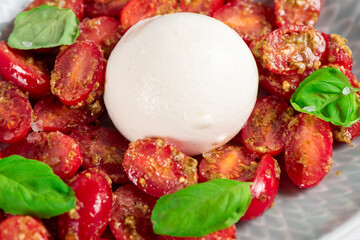 Farmer Italian soft cheese mozzarella served with fresh basil and red cherry tomatoes