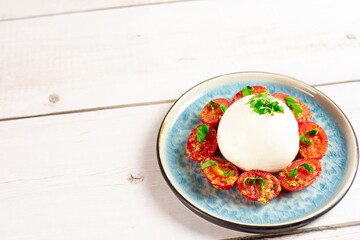 Farmer Italian soft cheese mozzarella served with fresh basil and red cherry tomatoes