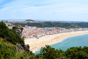 Aerial view to Nazare, Portugal and surrounding areas with stunning seascape of Atlantic ocean
