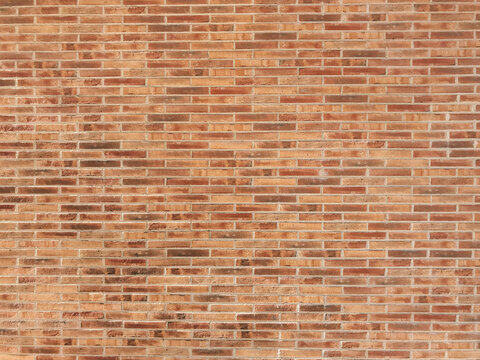 Brick wall with a red brick pattern