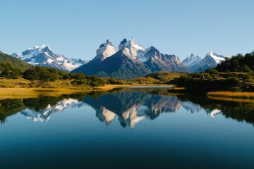 Majestic snow capped mountains reflected in tranquil lake