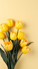Obraz premium Top view of yellow tulips on studio background