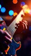 Obraz premium Close-Up of a Musician Playing an Electric Guitar on Stage with Colorful Lights