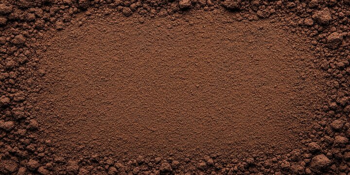 Dark Brown Soil Texture: Rich, dark brown soil forms a natural frame, showcasing its fine texture and earthy tones. Perfect for backgrounds or agricultural themes.