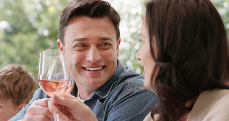 Family, toast and people with cheers, brunch and celebrate holiday or vacation together. Love, wine and social gathering for man, woman and happy parents bonding at lunch with alcohol beverage