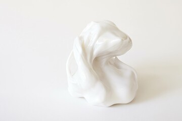 Fototapeta premium Abstract white sculpture representing a gentle rabbit shape, showcasing fluid lines and smooth textures, ideal for minimalistic art approaches and modern decor