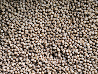 Fish concentrate is round in shape. Fish feed concentrate background.