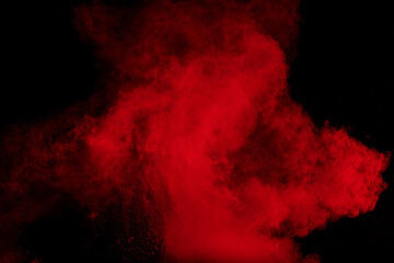 Red cloud of powdery dust is blowing in the wind.