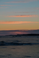 Obraz premium sunset over the lake with ice cover