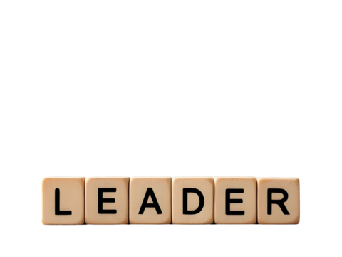 Wooden letter blocks spelling _LEADER_ hand placing final _R_ block - Powered by Adobe