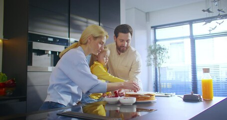 Engaging in Family Activities in the Modern Kitchen by Preparing Breakfast Together. A joyful family bonding moment as they enthusiastically prepare breakfast together in a modern, vibrant kitchen