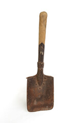 Short vintage military shovel with worn edges and rust pattern, isolated on white background