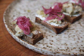 close-up of the appetizer plate with bread herring tartare.