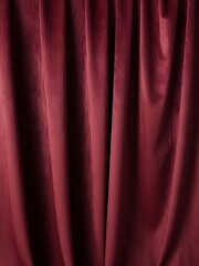 Minimalist red background with a brushed velvet texture, evoking elegance and warmth.