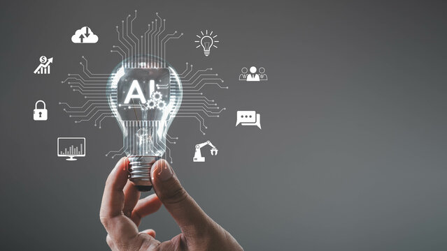 Hand holds a glowing light bulb with AI icons, symbolizing innovation and future in technology. Concept of artificial intelligence and digital transformation.