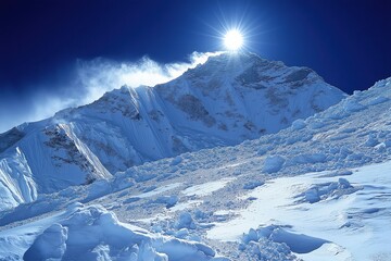 Naklejka premium Stunning view of snow-covered mountain peak illuminated by sunlight at high altitude