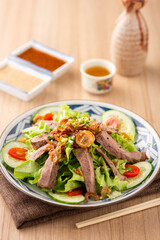 Fresh Salad with Grilled Meat and Colorful Vegetables on Plate