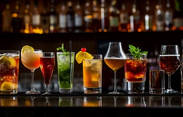 Fototapeten Different alcohol drinks on table in bar  © Petr Bonek