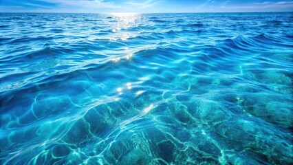 Obraz premium Tranquil ocean surface with gentle waves and sunlight reflecting off the water, revealing a glimpse of the depths below