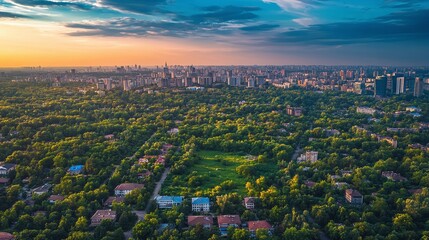 Obraz premium Aerial cityscape at sunset urban green spaces nature landscape vibrant environment panoramic view urban development