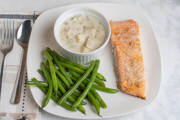 baked seasoned salmon  with green beans and chowder