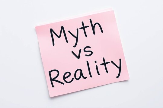 Text Myth vs Reality on pink note on white background