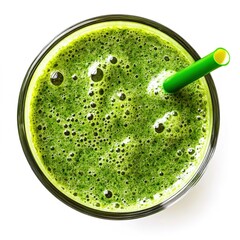 Overhead photo of an oversized glass filled with a vibrant green smoothie, a straw, and a leaf inside the drink.