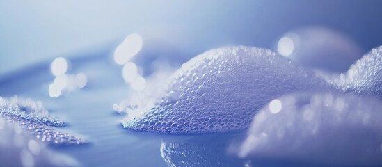 Abstract close-up of soap bubbles on surface with soft blue lighting and Copy Space for text placement