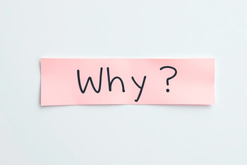 Text Why on pink note on white background