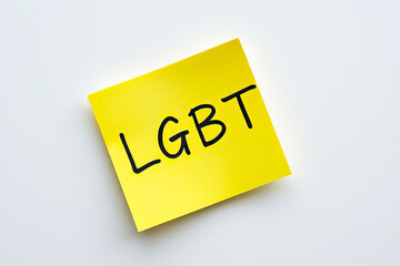 Text LGBT on yellow note on white background