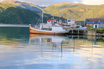 Old wooden fishing boats at the quay in Rognan, Salten
